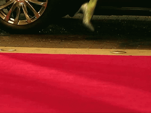 Woman in Blue Dress Walking on Red Carpet da ta ta ta