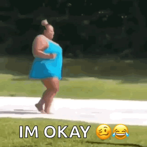 Woman in Blue Dress Walking With Im Okay