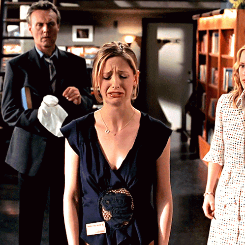 Woman in Blue Dress With Name Tag Sarah