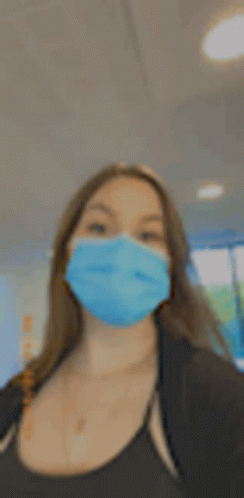 Woman in Blue Face Mask Taking Selfie