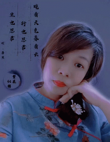 Woman in Blue Floral Shirt Looking at Camera