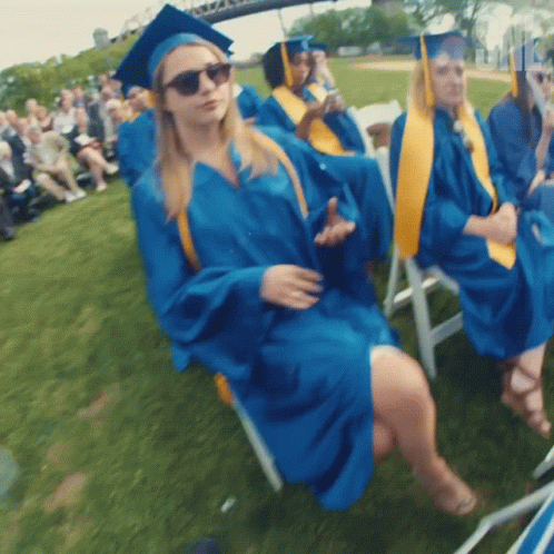 Woman in Blue Graduation Cap and Gown