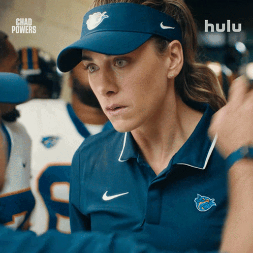Woman in Blue Hat and Blue Shirt With Hulu Logo
