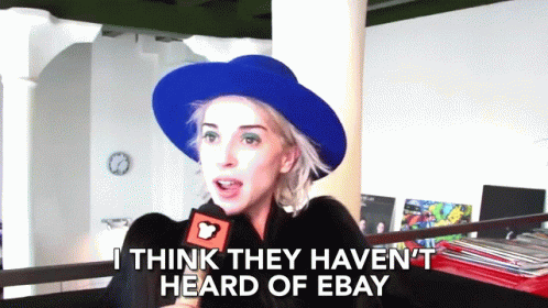Woman In Blue Hat Talking Into Microphone GIF