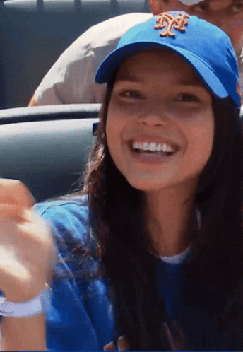 Woman in Blue Hat With NY Smiling