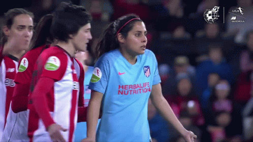 Woman in Blue Herbalife Nutrition Shirt With Teammates