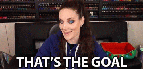 Woman in Blue Hoodie Smiling Says Goal