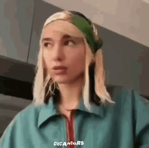 Woman in Blue Jacket and Green Headband