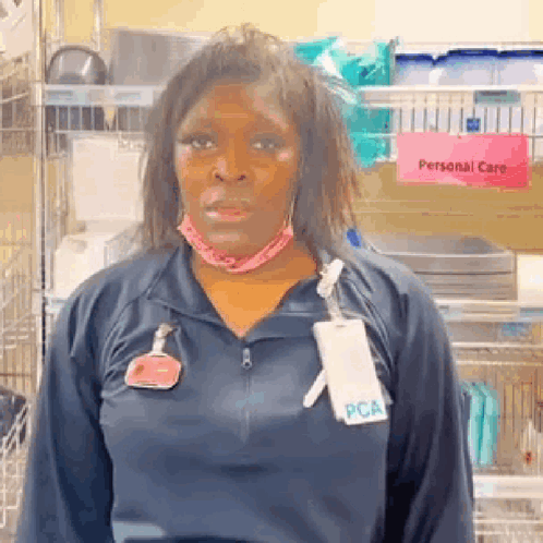 Woman in Blue Jacket and Name Tag