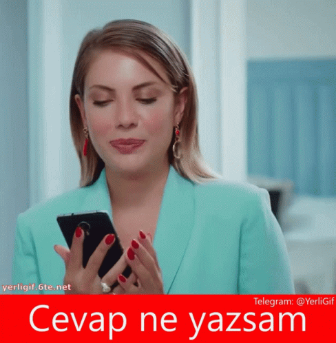 Woman in Blue Jacket Holding Phone Saying Cevap Ne Yazsam