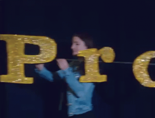 Woman in Blue Jacket Holding Pro Sign