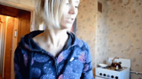 Woman in Blue Jacket in Kitchen
