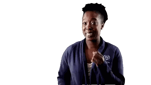 Woman in Blue Jacket Laughing and Raising Hands