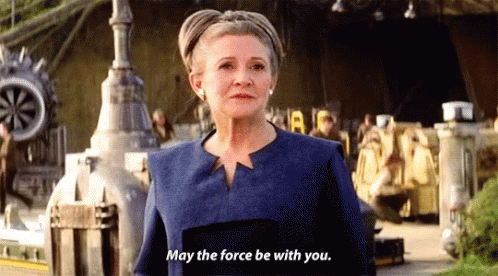 Woman In Blue Jacket Saying May The Force Be With You GIF