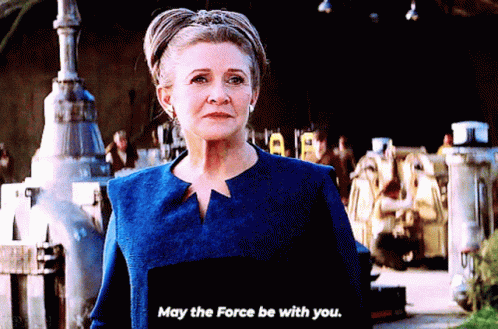 Woman in Blue Jacket Saying May The Force Be With You