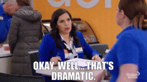 Woman in Blue Jacket Talking to Another at Counter