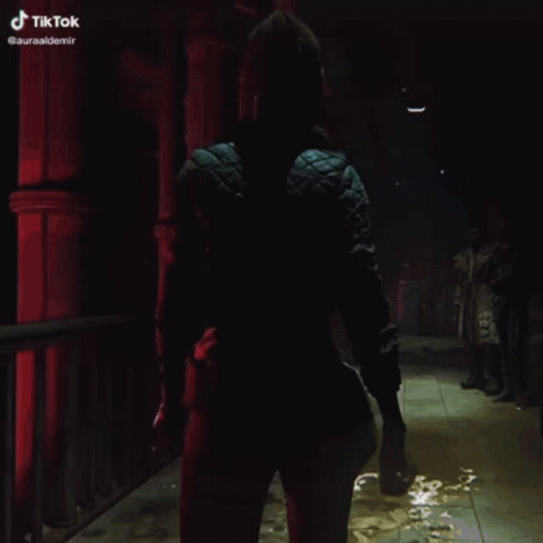 Woman in Blue Jacket Walking Dark Hallway TikTok