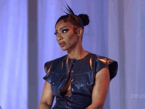 Woman in Blue Leather Top with Zeus