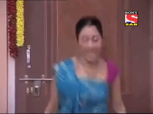 Woman In Blue Saree Standing By Sony Logo GIF