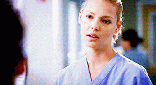 Woman In Blue Scrub Top Talking GIF