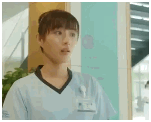 Woman in Blue Scrub Top with Aoyama Name Tag