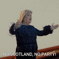Woman in Blue Sequined Dress Saying No Scotland No Party