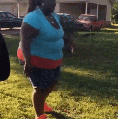 Woman In Blue Shirt And Red Shorts GIF