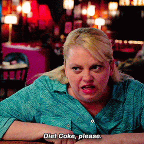 Woman in Blue Shirt Asking for Diet Coke