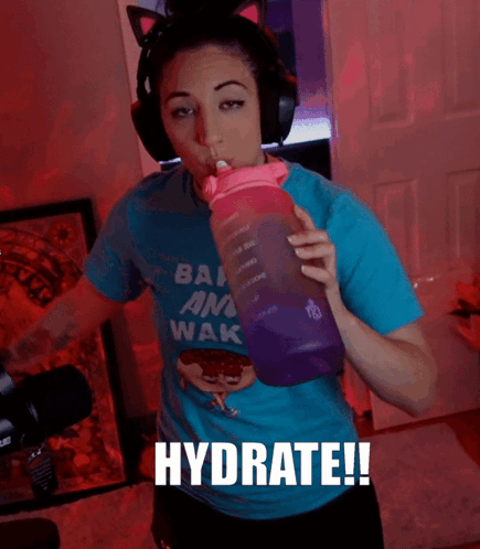 Woman in Blue Shirt Ban Am Wak Drinking Purple Water Bottle