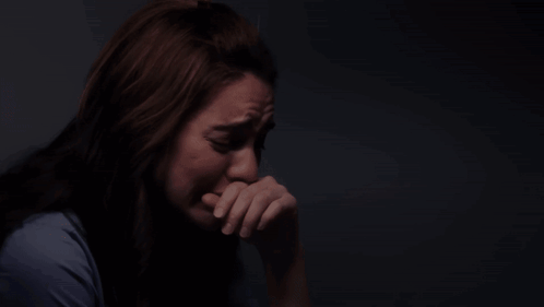 Woman in Blue Shirt Crying