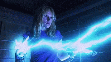 Woman In Blue Shirt Holding Lightning Bolt Next To Global HD Sign GIF