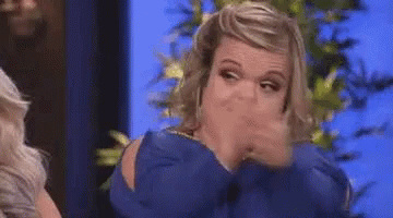 Woman In Blue Shirt Making Funny Face GIF
