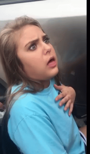 Woman in Blue Shirt Making Funny Face