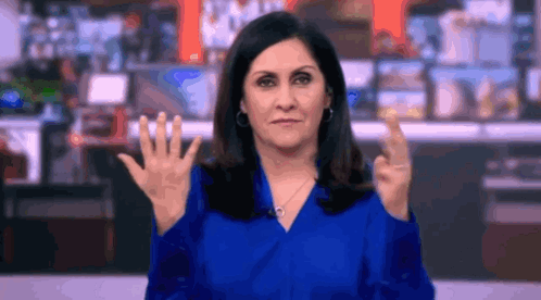 Woman in Blue Shirt Making Rude Gesture