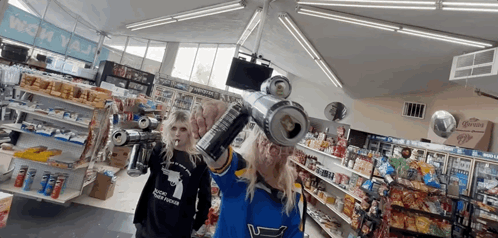 Woman in Blue Shirt No. 1 Holding Soda