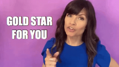 Woman In Blue Shirt Pointing Gold Star For You GIF