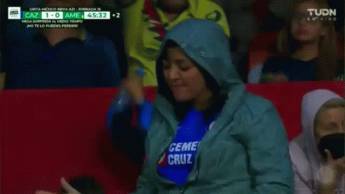 Woman in Blue Shirt Saying Ceme Cruz