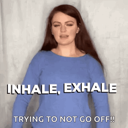 Woman in Blue Shirt Saying Inhale Exhale