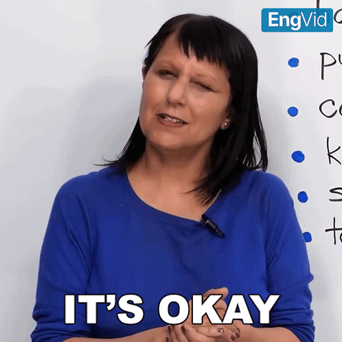 Woman in Blue Shirt Saying It's Okay