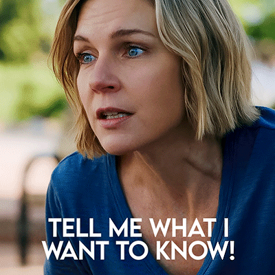Woman in Blue Shirt Saying Tell Me What I Want to Know