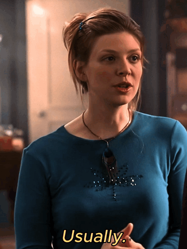 Woman in Blue Shirt Says Usually in Yellow Letters