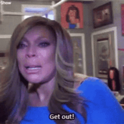 Woman in Blue Shirt Screaming Get Out