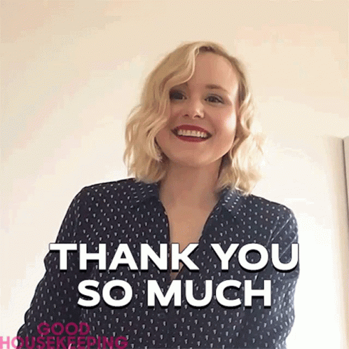 Woman in Blue Shirt Smiling Saying Thank You So Much
