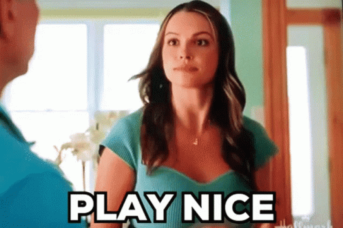 Woman in Blue Shirt Tells Man Play Nice