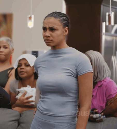 Woman In Blue Shirt With Group Saying Zeus GIF