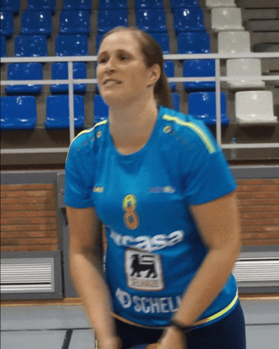 Woman in Blue Shirt With Number 8