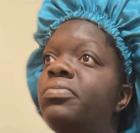 Woman In Blue Shower Cap Looking Up GIF