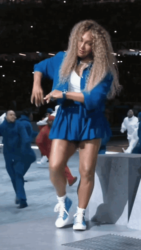 Woman in Blue Skirt Dancing