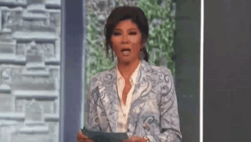 Woman in Blue Suit Holding Paper and Making Face