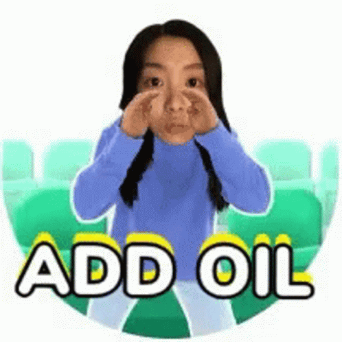 Woman in Blue Sweater Covering Nose Saying Add Oil